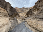 Death Valley dry stream bed through narrow canyon